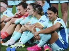  ?? ?? Australia’s Sam Kerr, right, sits with her teammates following their loss to Sweden in Saturday’s Women’s World Cup third-place match.