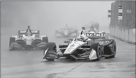  ?? AP/CARLOS OSORIO ?? Josef Newgarden (right) raced through the rain to win Race 1 of the IndyCar Detroit Grand Prix at Belle Isle on Saturday. Race 2 is today.