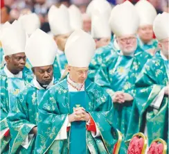  ?? (Remo Casilli/Reuters) ?? CARDINALS LEAVE after a mass led by Pope Francis yesterday to open a three-week synod of Amazonian bishops at the Vatican.