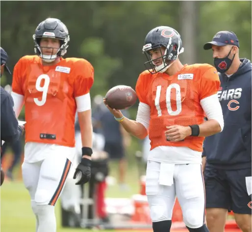  ?? AP PHOTOS ?? It’s no surprise quarterbac­ks Nick Foles (left) and Mitch Trubisky will be on the team, but it’s still unclear which one will be the Bears’ starter.