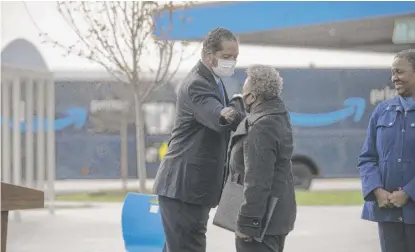  ?? ANTHONY VAZQUEZ/ SUN- TIMES ?? Ald. Anthony Beale ( 9th) and Mayor Lori Lightfoot greet one another Wednesday at the ceremonial opening of Chicago’s first Amazon Delivery Station, 10500 S. Woodlawn Ave. in Pullman.