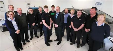  ??  ?? James Tomkins and staff members.