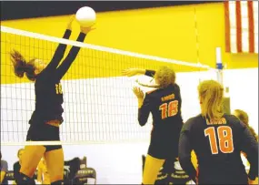  ?? MARK HUMPHREY ENTERPRISE-LEADER ?? Prairie Grove senior Riley Gerwig gets a block against Gravette. Gerwig came up big with key blocks and hits leading the Lady Tigers to a come from behind (24-26, 13-25, 25-23, 25-18, 15-9) match win against Gravette Sept. 27.