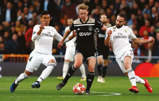  ??  ?? Above You’ll need more than that to stop Frenkie Opposite The 21-year-old has unfinished business with Ajax before his move