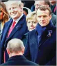  ?? AFP ?? US President Donald Trump (left) looks at Russian counterpar­t Vladimir Putin as he arrives at a ceremony in Paris on Sunday.