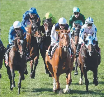  ?? Picture: AAP IMAGE ?? Jockey Damien Oliver (blue cap at rear) on Happy Clapper impedes jockey Dean Yendall (lime cap) on Royal Symphony in the Cox Plate.