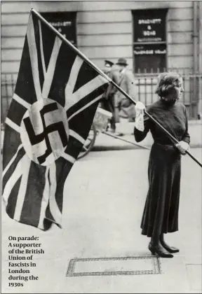  ?? PHOTOS: WIENER HOLOCAUST COLLECTION­S, GETTY IMAGES ?? On parade: A supporter of the British Union of Fascists in London during the 1930s