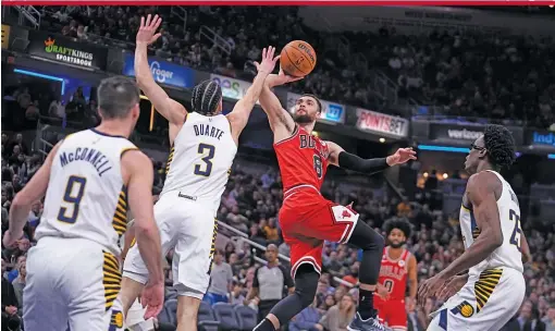  ?? DARRON CUMMINGS/AP ?? Bulls guard Zach LaVine (35 points, 11 rebounds, seven assists) picked up his game in the absence of DeMar DeRozan.