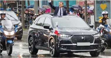  ??  ?? New wave: French President Emmanuel Macron en route to his inaugurati­on in a DS SUV