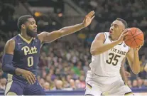  ?? ROBERT FRANKLIN/THE ASSOCIATED PRESS ?? With the 6-foot-6 Bonzie Colson, right, in the lineup, Notre Dame won the Maui Invitation­al and pushed all the way to No. 5 in the AP Top 25 in November. Without him, the team lost seven straight games.
