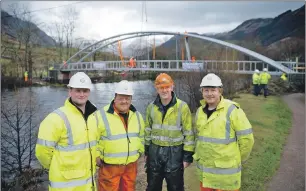  ??  ?? Left to right: Gary Moir, project manager; Clark Hurley, fabricatio­n foreman; and Ally Stevens and Cliff Robertson, installati­on, at the new Glen Nevis bridge.