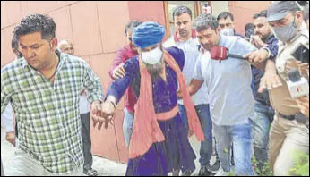  ?? PTI ?? Sarabjit Singh, accused in the murder of Lakhbir Singh at the Kundli border, being taken in police custody after a Sonepat court granted his remand on Saturday.