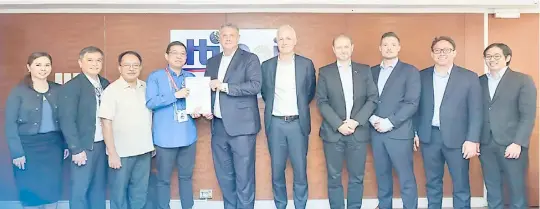  ?? PHOTOGRAPH COURTESY OF BOI ?? TRADE Undersecre­tary and BoI managing head Ceferino Rodolfo (fourth from left) awards the green lane certificat­e to Niels Holst, partner and co-head of the Growth Markets Fund (fifth from left), during a brief ceremony at the BoI office in Makati City.