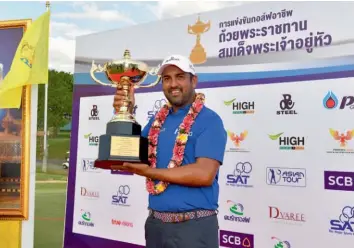  ??  ?? Shiv Kapur poses with the trophy after winning the Royal Cup in Pattaya, Thailand, on Sunday. This was Shiv’s third Asian Tour title of the year.