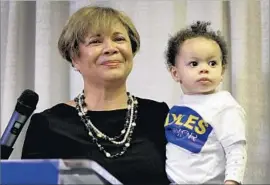  ?? Jeff Siner Charlotte Observer ?? DEMOCRAT VI LYLES, with her granddaugh­ter, will be the first black female mayor of Charlotte, N.C. Democrats made political gains across the country.