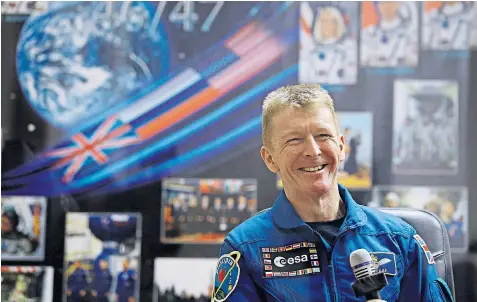  ??  ?? Major Tim to Ground Control: Britain’s first astronaut gives a prelaunch interview yesterday as a priest blesses his Soyuz FG rocket