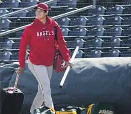  ?? Matt York Associated Press ?? SHOHEI OHTANI believes he can further adjust to the clock. “There’s still time, and the more I get used to it, I think I’ll be able to throw with better feel,” he said.