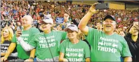  ?? MANDEL NGAN/GETTY-AFP ?? Supporters cheer Tuesday night for President Donald Trump in Council Bluffs, Iowa.