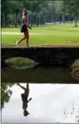  ?? BUTCH DILL — THE ASSOCIATED PRESS ?? Michelle Wie walks across a bridge from the sixth green during the second round of the U.S. Women’s Open at Shoal Creek, Friday in Birmingham, Ala.