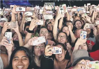  ?? PICTURE: ANGELA WEISS/AFP VIA GETTY IMAGES ?? Life is for living, not filming on a smartphone