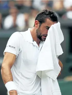  ?? DANIEL LEAL-OLIVA/GETTY IMAGES ?? Marin Cilic reacts during the Gentlemen’s Singles final against Roger Federer on Day 13 of the Wimbledon Lawn Tennis Championsh­ips at the All England Lawn Tennis and Croquet Club at Wimbledon on Sunday, in London, England.