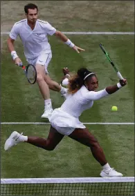  ?? AP/KIRSTY WIGGLESWOR­TH ?? Serena Williams and Andy Murray team up in a Wimbledon mixed doubles match Saturday in London. The duo defeated Alexa Guarachi and Andreas Mies 6-4, 6-1.