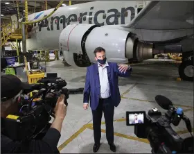 ?? (AP/Tulsa World/Mike Simons) ?? Ed Sangricco, managing director of American Airlines’ Tulsa base maintenanc­e, speaks to reporters last week. American Airlines’ net total losses stand to top $10 billion during the pandemic period.
