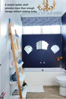  ??  ?? The once neutral bathroom felt too big and impersonal for the couple. To create a cosier space, they painted a dark blue focal wall in the same Dulux Shutter Blue as in the kitchen and hung different-shaped mirrors to add interest. “We were about to...