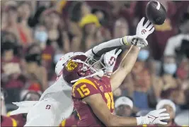  ??  ?? Trojans wide receiver Drake London can’t quite reach a pass against the Cardinal in the first half at the Coliseum in Los Angeles on Saturday.