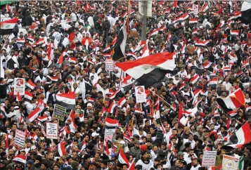  ?? ASSOCIATED PRESS ?? FOLLOWERS OF SHIITE CLERIC MUQTADA AL-SADR gather in Baghdad, Iraq, on Friday. Thousands of supporters of an influentia­l, radical Shiite cleric gathered in central Baghdad for a rally to demand that American troops leave the country amid heightened antiUS sentiment after a drone strike ordered by Washington earlier this month killed a top Iranian general in the Iraqi capital.