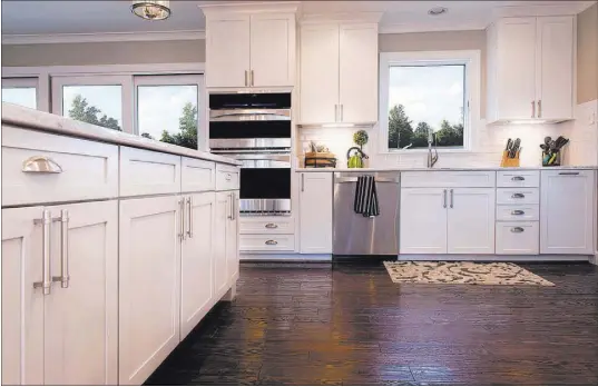  ?? THINKSTOCK ?? Something that’s again popular in modern kitchens: simple, white cabinets. People want a simple look that’s less chic and busy.