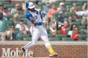  ?? AP PHOTO/HAKIM WRIGHT SR. ?? Atlanta Braves' Ronald Acuna Jr. hits a double in the first inning of Saturday's game against the Washington Nationals in Atlanta.