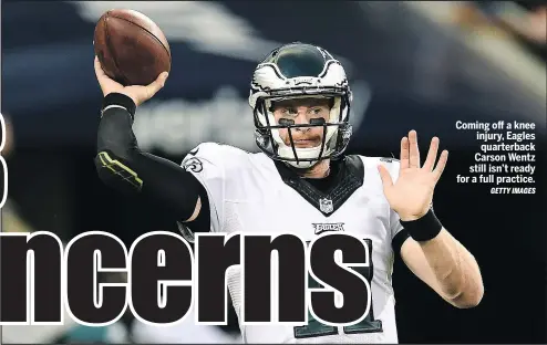  ?? GETTY IMAGES ?? Coming off a knee injury, Eagles quarterbac­k Carson Wentz still isn’t ready for a full practice.