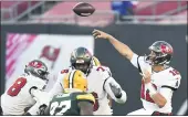  ?? JASON BEHNKEN — THE ASSOCIATED PRESS ?? Tampa Bay Buccaneers quarterbac­k Tom Brady (12) throws a pass against the Green Bay Packers during the second half Sunday in Tampa, Fla.