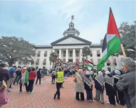  ?? DOUGLAS SOULE/TALLAHASSE­E DEMOCRAT ?? Pro-Palestinia­n protesters hold a rally outside of the Florida Capitol on Nov. 14, 2023.