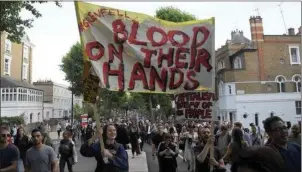  ??  ?? Protestors take to London’s streets after the Grenfell Towers tragedy.