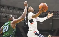  ?? Jessica Hill / Associated Press ?? UConn’s Alterique Gilbert (3) goes up to the basket as Tulane’s Blake Paul defends on Saturday.