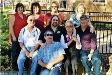  ?? COURTESY OF DONNA PEARCE ?? Donna Pearce, back row, far left, and other family members mark the occasion of Norma Welsh’s (centre with pink ribbon) 80th birthday. Pearce’s adoption story is a joyous one.