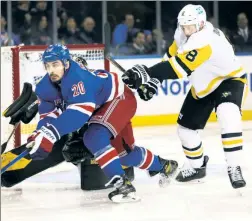  ?? Robert Sabo ?? VETERAN PRESENCE: Chris Kreider battles for the puck in the third period Thursday, when he scored twice to reach 30 goals for the second straight season.