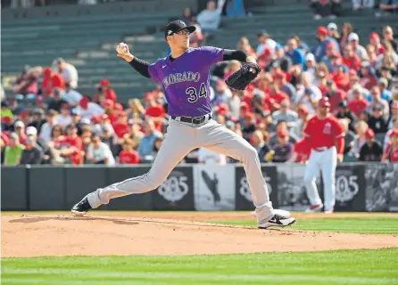  ?? RJ Sangosti, The Denver Post ?? The Rockies’ Jeff Hoffman delivers during the first inning Sunday against the Los Angeles Angels in Colorado’s spring training debut. He allowed two runs on three hits, striking out three in two innings in a 7-5 loss.