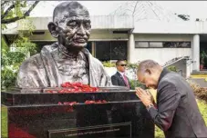  ?? PTI ?? President Ram Nath Kovind pays tribute at the bust of Mahatma Gandhi after it was unveiled by him at Miriam College, Quezon City, Manila, Philippine­s , Sunday