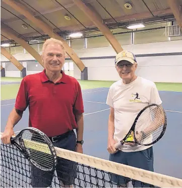  ?? DENNIS CROSBY/THE BEACON-NEWS/TNS ?? Frank Asta, 78, of Batavia, left, and Warren Moulds, 85, of Geneva take a few minutes to relax after playing tennis at the DuPage County Fairground­s in Wheaton, Ill.