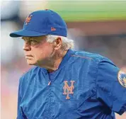  ?? Chris Szagola/Associated Press ?? New York Mets manager Buck Showalter waits for the team’s baseball game against the Philadelph­ia Phillies last season in Philadelph­ia.