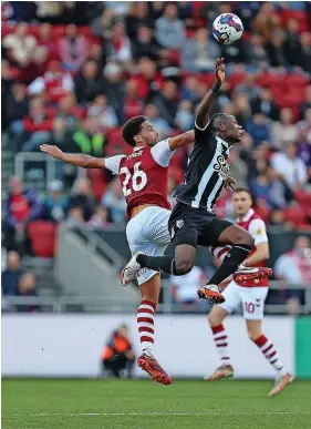  ?? ?? City defender Zak Vyner has an aerial battle in Saturday’s game