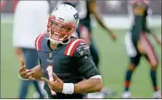  ?? AP-charles krupa ?? New England Patriots quarterbac­k Cam Newton celebrates after defeating the Las Vegas Raiders on Sept. 27 in Foxborough, Mass.