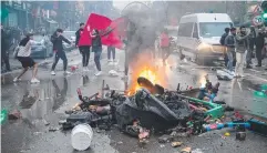  ?? ?? Moroccan fans celebrate during chaotic scenes in Brussels.