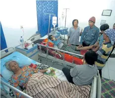  ?? GETTY IMAGES ?? Injured residents receive medical treatment at a hospital after an avalanche of mud and rocks struck Pasirpanja­ng in Brebes district, Indonesia, on Thursday. At least five people have been killed and 15 are missing.