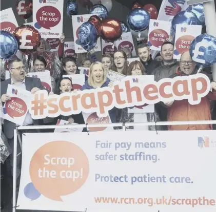  ??  ?? 0 The Royal College of Nursing stages a Scrap the Cap pay protest outside the Scottish Parliament in 2017