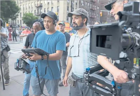  ?? PHOTOS: WARNER BROS. ENTERTAINM­ENT ?? Bay Area native Jon M. Chu, left, and Lin-Manuel Miranda confer on set during filming of “In the Heights.” Miranda co-wrote the original Broadway musical of the same name.