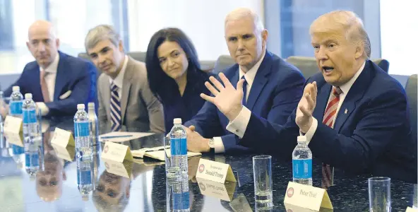  ?? AFP/GETTY IMAGES ?? Late last year, Amazon’s chief Jeff Bezos, left, Larry Page of Alphabet, Facebook COO Sheryl Sandberg, then-U.S. vice-president-elect Mike Pence and then-president-elect Donald Trump met at Trump Tower. These executives and others from tech firms have...